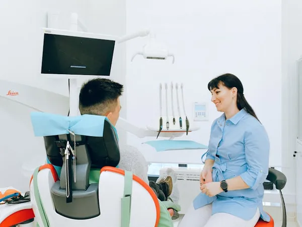 Dentist consulting with a patient