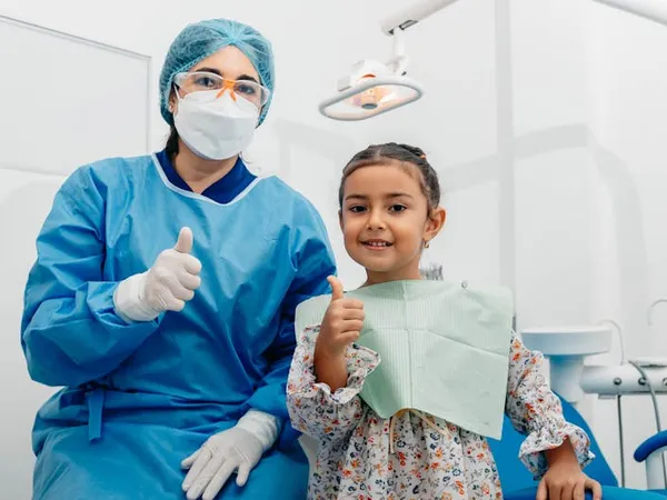 Dentist and patient celebrating a great result