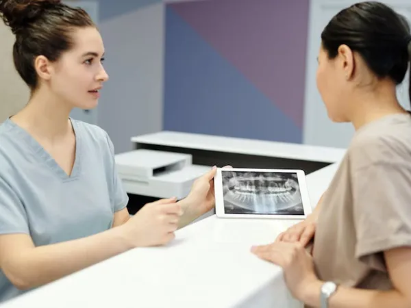 Dentist explaining treatment options to a patient